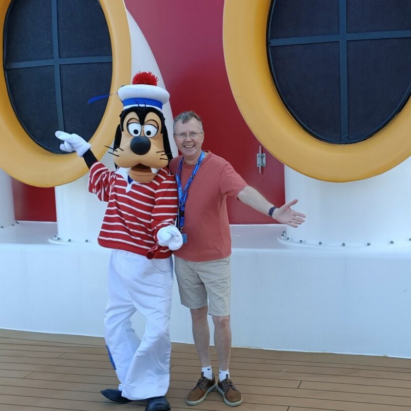 Philip Clape with Goofy on Disney Wonder - Image by Holidays Beckon